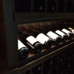 This display row is lit by a custom strip of LED lights that highlight the beautiful bottles.