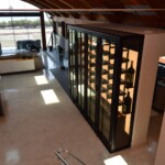 In an open floor plan like this one, a custom modern wine cellar is an incredible fit.