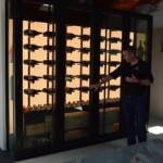 Jake demonstrates the adjustable LED lighting in this modern residential wine cellar.