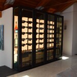 Custom Wine Cellars Dallas has a team of experts that can create stunning modern wine storage spaces like this one.