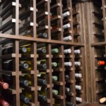 Custom wooden wine racks like these combine form and function in a residential or commercial wine cellar.